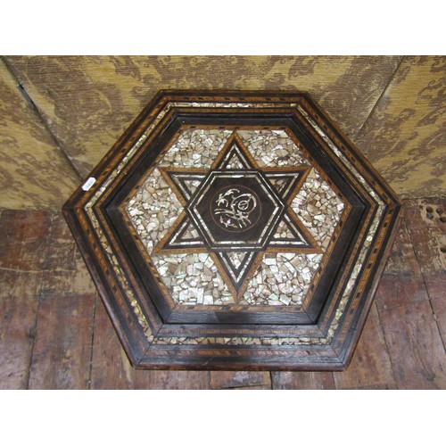 1372 - A Liberty & Co Syrian Anglo Moresque table of hexagonal form, with inlaid and ebonised frame and mot... 