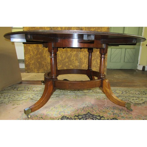 1374 - A good quality Regency style mahogany extending dining table on four turned support, the circular to... 