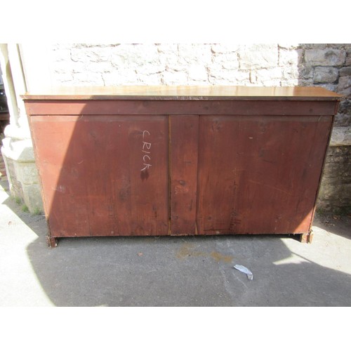 1375 - A Victorian walnut breakfront credenza enclosed by a central solid door, flanked by further glass do... 