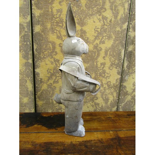 1381 - A free standing carved wooden model of a suited rabbit, 68cm high