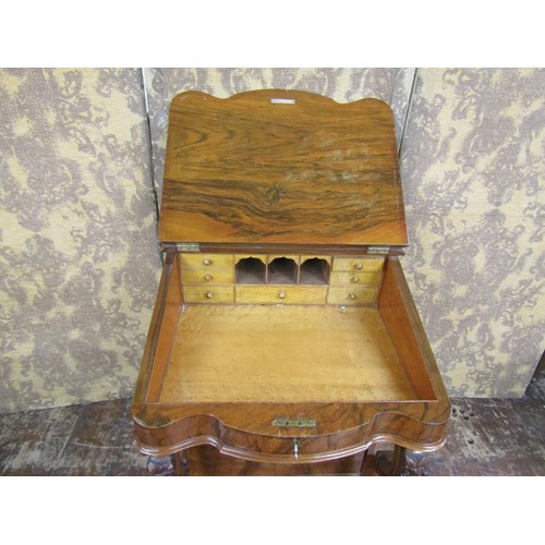 1382 - A Victorian figured walnut davenport of usual form with cabriole supports and gilt tooled leather to... 