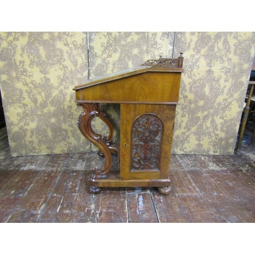 1382 - A Victorian figured walnut davenport of usual form with cabriole supports and gilt tooled leather to... 