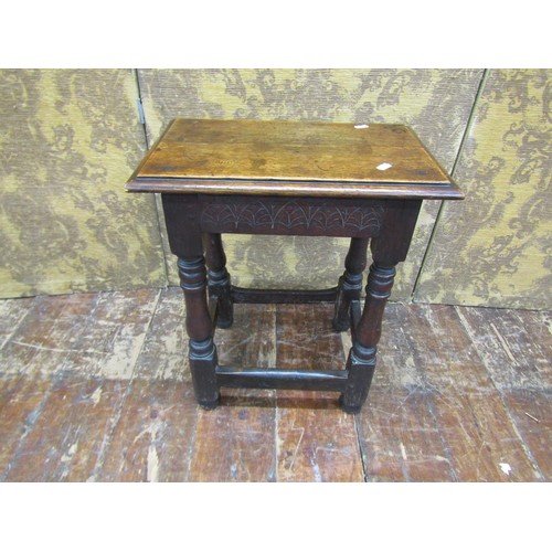 1383 - An antique oak joint stool of usual form with simple carved detail, 53cm high