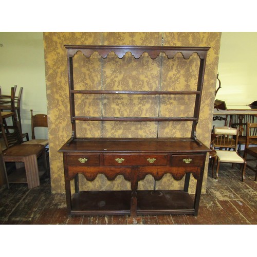 1386 - An early Georgian oak cottage pot-board dresser incorporating three drawers with plate rack above, 1... 