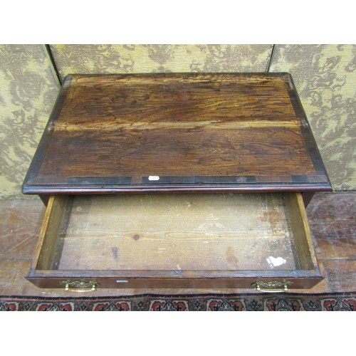 1389 - A Georgian oak country made low boy of three drawers to a central arch on chamfered supports, 76cm w... 