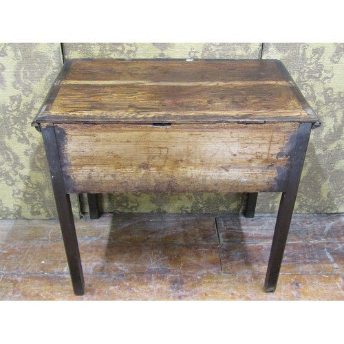 1389 - A Georgian oak country made low boy of three drawers to a central arch on chamfered supports, 76cm w... 