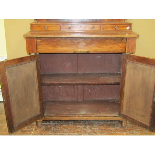 1401 - A Regency mahogany chiffonier enclosed by a pair of open doors with brass grille detail, flanked by ... 