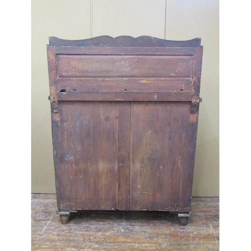 1401 - A Regency mahogany chiffonier enclosed by a pair of open doors with brass grille detail, flanked by ... 