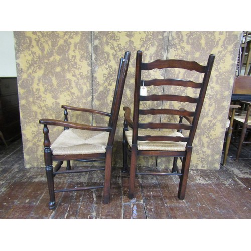 1402 - Pair of good quality old English style ladderback elbow chairs in oak with rush seats