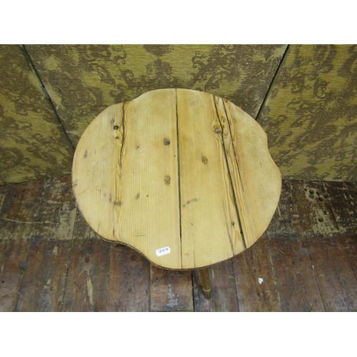 1403 - A stripped and waxed pine cricket table with shaped top on tapering splayed supports