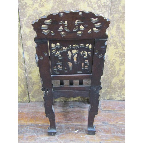 1411 - A 19th century carved Chinese hardwood elbow chair, profusely decorated with dragons, characters, sc... 