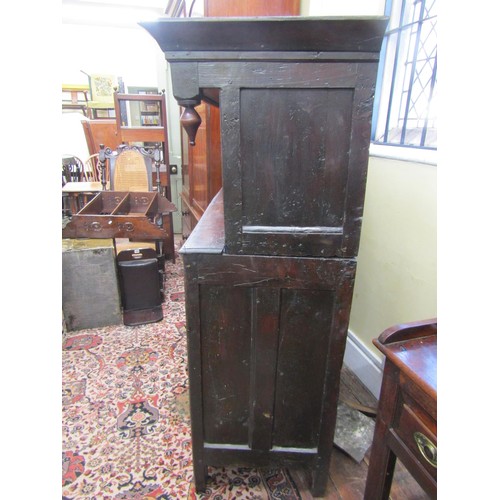 1415 - 18th century oak court cupboard of small proportions, enclosed by a series of doors and drawers, mon... 