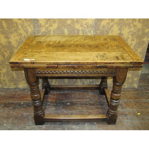 1408 - A good quality old English style oak draw leaf dining table of small proportions on turned supports,... 