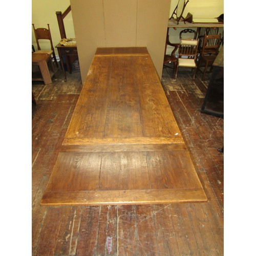 1418 - An oak draw leaf refectory table in the Georgian style, 215cm long when closed (305cm when open) x 9... 