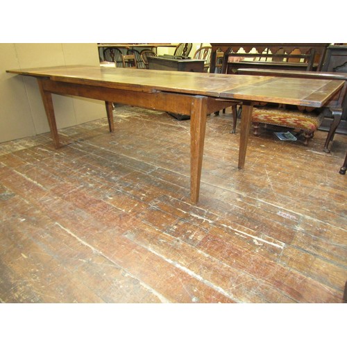 1418 - An oak draw leaf refectory table in the Georgian style, 215cm long when closed (305cm when open) x 9... 