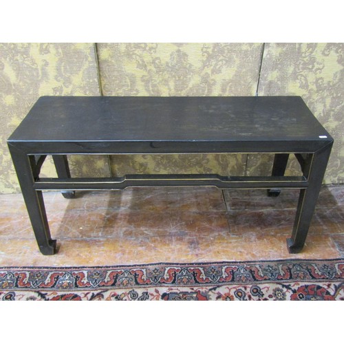 1419 - A Chinese occasional table of rectangular form with ebonised finish, 55cm high x 110cm x 38cm