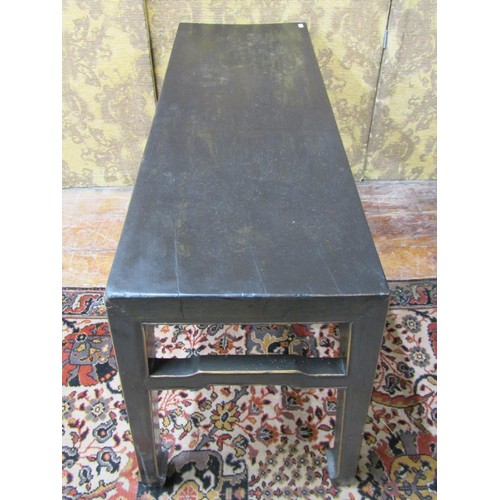 1419 - A Chinese occasional table of rectangular form with ebonised finish, 55cm high x 110cm x 38cm