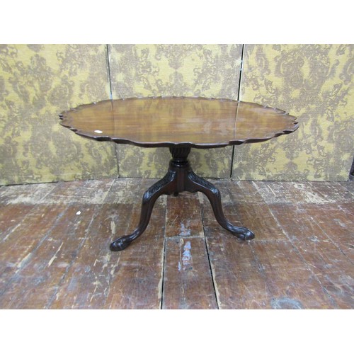 1427 - A Georgian mahogany occasional table raised on a reduced stem and tripod, the top 85cm diameter