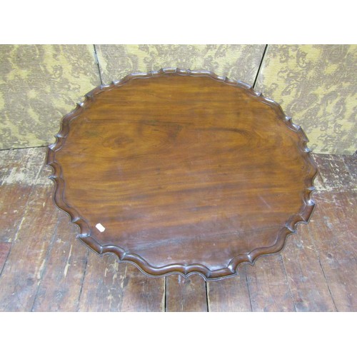 1427 - A Georgian mahogany occasional table raised on a reduced stem and tripod, the top 85cm diameter