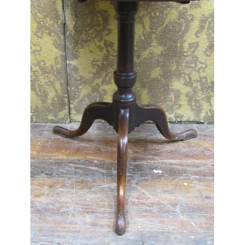 1428 - A Georgian mahogany snap top table on gun barrel pillar and tripod base, 71cm diameter