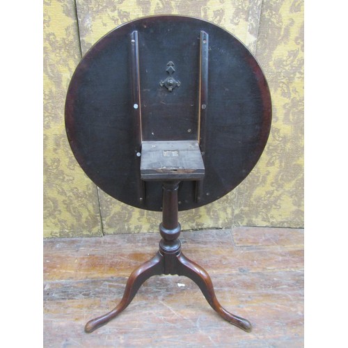 1428 - A Georgian mahogany snap top table on gun barrel pillar and tripod base, 71cm diameter