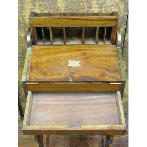 1430 - A 19th century camphor wood travelling desk raised on an associated stand, the fall flap enclosing a... 