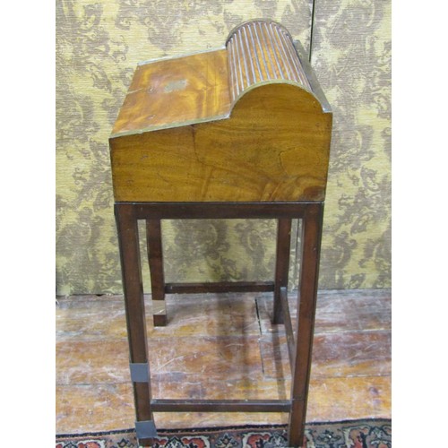 1430 - A 19th century camphor wood travelling desk raised on an associated stand, the fall flap enclosing a... 