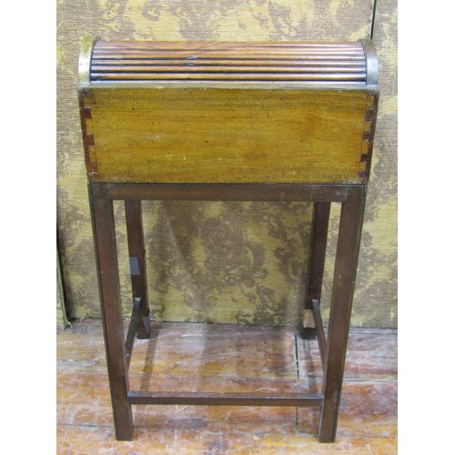 1430 - A 19th century camphor wood travelling desk raised on an associated stand, the fall flap enclosing a... 