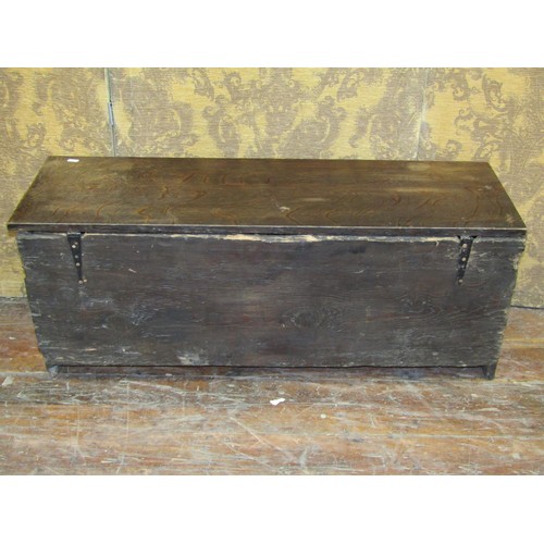 1433 - An oak boarded coffer monogrammed W B 1729, with steel lock plate and hasp, 103cm long