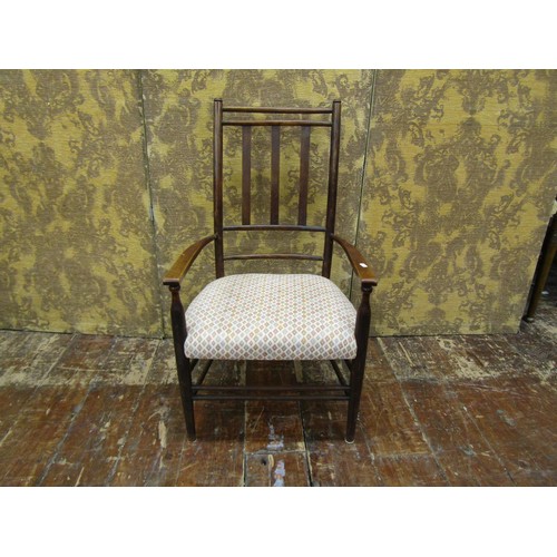 1439 - An arts and crafts armchair in beechwood with upholstered seat