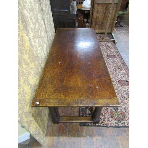 1441 - An old English style refectory table in the Cromwellian manner raised on four gun barrel supports, 1... 