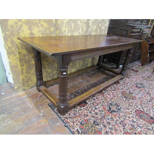 1441 - An old English style refectory table in the Cromwellian manner raised on four gun barrel supports, 1... 