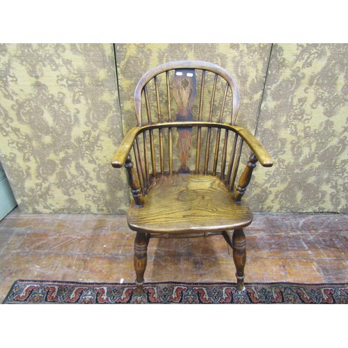 1445 - A Georgian Windsor chair in ashwood