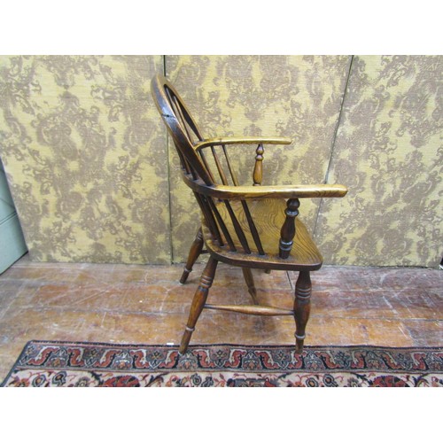 1445 - A Georgian Windsor chair in ashwood