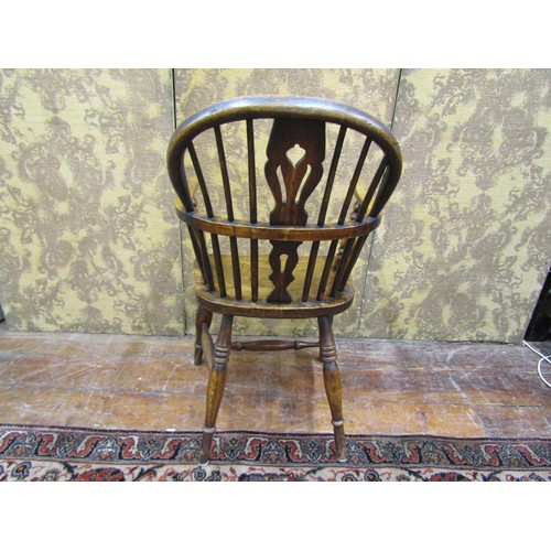 1445 - A Georgian Windsor chair in ashwood