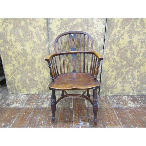 1446 - A Georgian Windsor chair principally in ashwood with crinoline stretcher