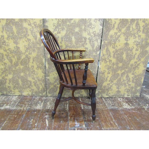 1446 - A Georgian Windsor chair principally in ashwood with crinoline stretcher