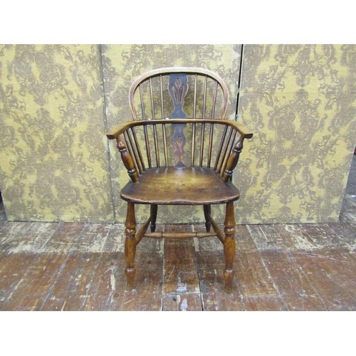 1447 - A Georgian Windsor elm and ashwood elbow chair, with pierced splat