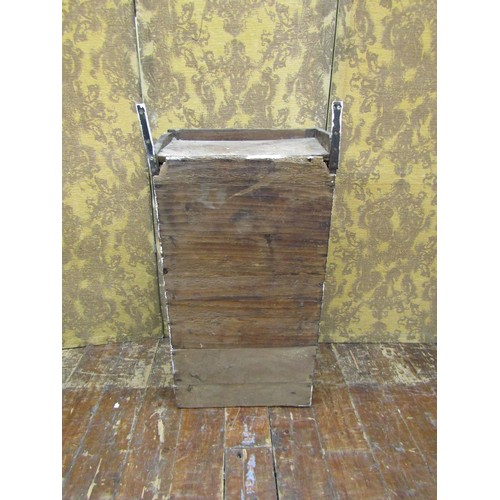 1452 - An 18th century oak wall mounted cupboard enclosed by a shaped and fielded panelled door with elm li... 