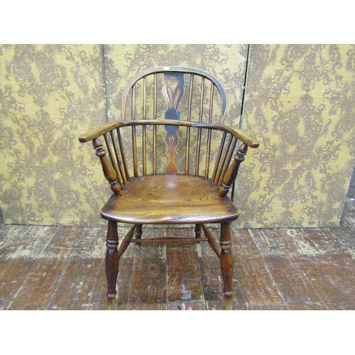 1454 - A Georgian Windsor elm and ashwood elbow chair