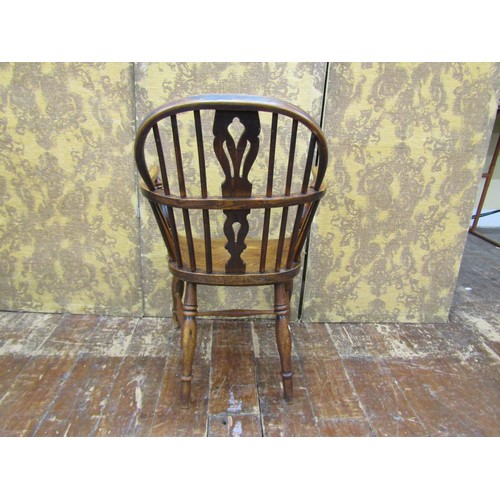 1454 - A Georgian Windsor elm and ashwood elbow chair