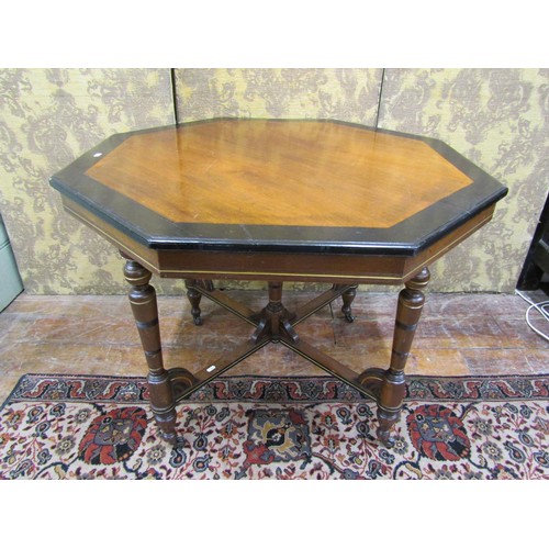 1467 - A late Victorian octagonal table in the aesthetic manner, raised on five turned supports with gilt l... 