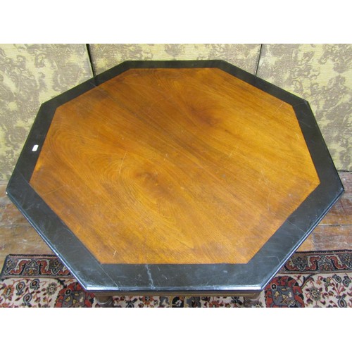 1467 - A late Victorian octagonal table in the aesthetic manner, raised on five turned supports with gilt l... 