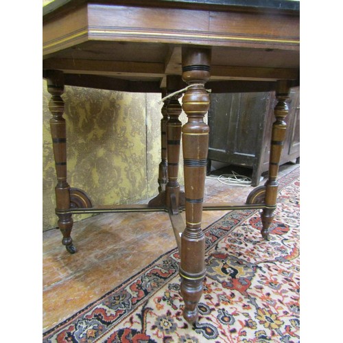 1467 - A late Victorian octagonal table in the aesthetic manner, raised on five turned supports with gilt l... 