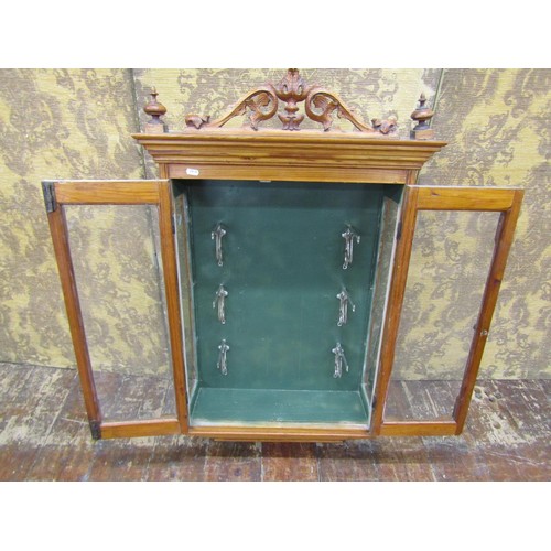 1470 - A Victorian pitch pine wall hanging display cabinet with glazed panels, chrome fittings and set bene... 