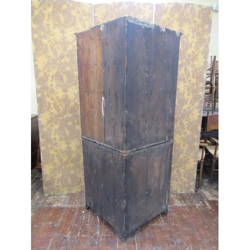 1473 - A late Georgian oak corner cupboard freestanding, the upper section with astragal glazed panel doors... 