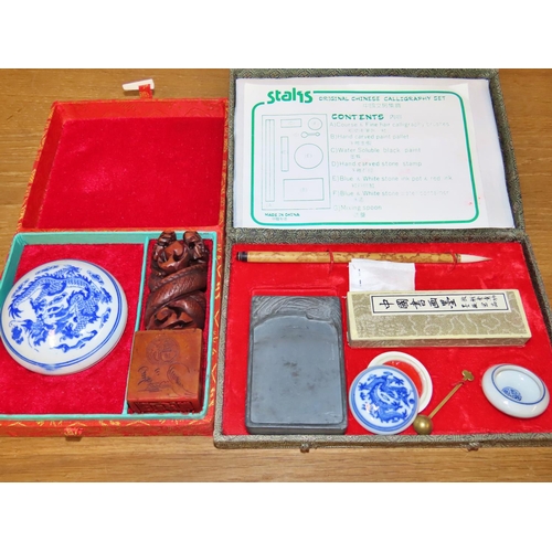 595 - A collection of calligraphy items - pens and books and ephemera