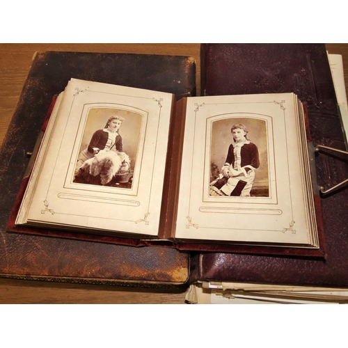 611 - Three Victorian photograph albums containing mostly portraiture but also family groups and interesti... 