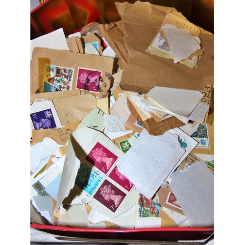 623 - Two tins of unsorted stamps together with a collection of First Day Covers