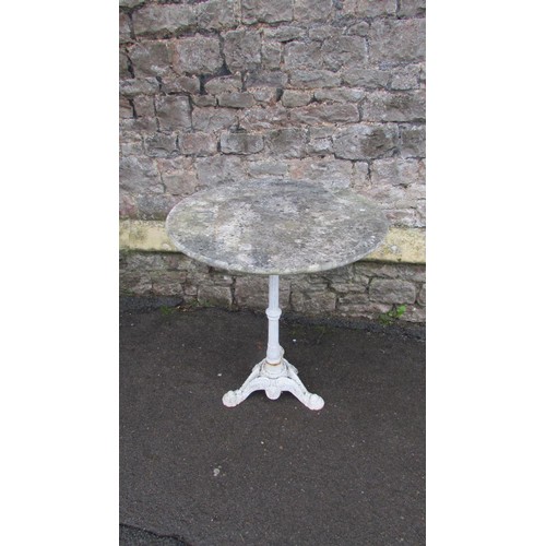 1065 - A garden table, the base with painted column, raised on three swept dolphin supports beneath a nicel... 